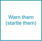 Warn them (startle them)